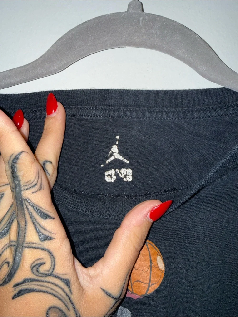 Jordan Black Tee with Orange Basketball Graphic and Red Accents
